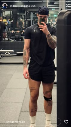 a man in shorts and knee pads taking a selfie