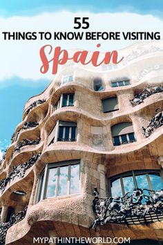 a tall building with the words 5 things to know before visiting spain