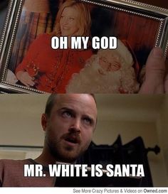 a man holding up a framed photo with the caption oh my god mr white is santa