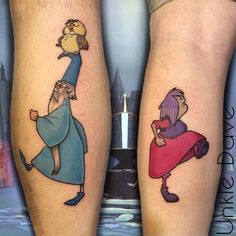 two people with tattoos on their legs that look like they are holding up an animal