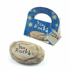 a rock with the word you rock written on it next to a magnet that says you rock