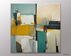 an abstract painting with yellow, blue and white colors on the wall in front of a gray background