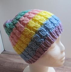 Beanie-style Hat, handknit from acrylic yarn in Rainbow Pastel, machine washable ages 2 to 5 years HANDMADE in AMERICA Cute Multicolor Crochet Hat One Size, Cute Multicolor Crochet Hat, Cute Knitted Yarn Beanie, Cute Multicolor Hand Knitted Crochet Hat, Cute Multicolor Hand-knitted Crochet Hat, Multicolor Hats For Playtime, One Size Fits Most, Acrylic Yarn Beanie Knitting Pattern, Hand Knitted Beanie Knitting Pattern With Acrylic Yarn, Adjustable Multicolor Knit Crochet Hat