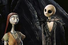 two cartoon characters dressed in halloween costumes standing next to each other, one wearing a skeleton mask