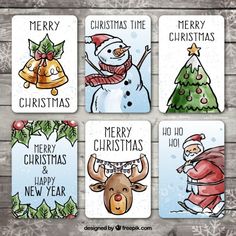 four christmas cards with santa claus, snowman and other holiday items in them on a wooden background