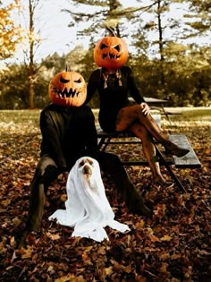 two people in costumes sitting on a bench