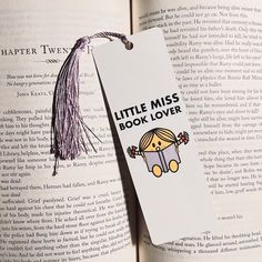 an open book with a little miss book lover tag attached to it's cover