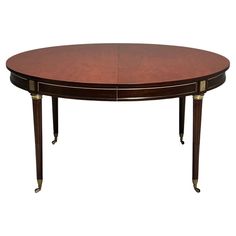 an oval dining table with two leaves on each end