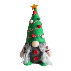 a green and red christmas tree with a gnome's hat on it, sitting in front of a white background