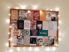 a bulletin board covered in posters and lights