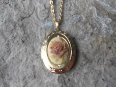 Beautiful cameo locket!!!  The cameo is a gorgeous Rose, choose pink or brown, many other styles and colors available in my shop, so please do browse!!!  The locket is gold plated, victorian style with beautiful scroll on the front and back.  It can hold two photos, keepsakes, or even your daily medication or vitamins!!! The chain is 20" gold plated link chain with a lobster claw clasp!!! Perfect  for Brides or Bridal parties.  Makes a unique memorable gift for any occasion!!!  Timeless classic Unique Locket Necklace Vintage, Cute Necklace Gold, Flower Locket Necklace, Vintage Rose Gold Locket Necklace For Wedding, Rose Gold Vintage Charm Locket Necklace For Wedding, Vintage Rose-colored Jewelry For Gifts, Vintage Rose Design Jewelry As A Gift, Oval Rose Design Jewelry For Wedding, Vintage Pink Jewelry For Keepsake