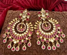 Elevate your style with our wide ruby chandbali earrings, beautifully crafted in 24K gold plating. Perfect for weddings and special occasions, these big statement earrings feature intricate Kundan details. Earrings are Approximately 3.2 Inches Long and 2 Inches Wide  A Earring Weight is 1.3 oz  Our products are meticulously handcrafted, ensuring each piece is unique. Due to the manual craftsmanship, you may notice slight irregularities, which are natural and do not compromise the quality of the jewelry. Red Hand-set Chandbali Jewelry, Red Jeweled Kundan Earrings, Ornate Gold-plated Chandbali Jewelry, Festive Red Kundan Chandelier Earrings, Pink Kundan Chandelier Earrings, Big Statement Earrings, Chandbali Earrings, Pakistani Jewelry, Indian Wedding Jewelry