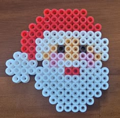 a close up of a santa clause made out of spools