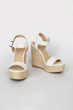 Seize the day and make it great in the Lulus Beachy Dreams White Espadrille Wedges! White faux leather shapes a fun peep-toe upper and matching quarter strap that secures with a silver buckle. Trendy espadrille details wrap around the 1.25"" toe platform and the study wedge heel adding a beach, relaxed vibe. 5" espadrille-wrapped wedge. Cushioned insole. Rubber sole has nonskid markings. Man made materials. Imported. Lulus | Beachy Dreams White Espadrille Wedges | Size 7. Beach Heels Wedges, Beach Sandals Aesthetic, Beachy Heels, Beach Heels, Shoes For Beach, Peep Toe Wedge Sandals, White Espadrilles, Heels Aesthetic, Heeled Espadrilles