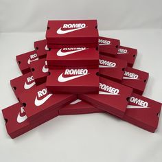 a bunch of red boxes with white nike logos on them