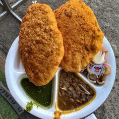 two fried food items on a paper plate