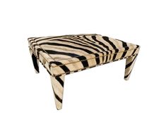 a zebra print footstool is shown on a white background with black and white stripes