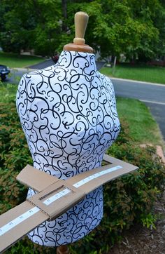 a mannequin with a cardboard box on it