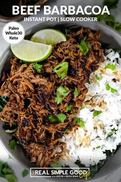 beef barbacoa in a bowl with rice and cilantro on the side