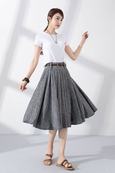 "Add some vintage-inspired charm to your wardrobe with our gray linen pleated swing circle skirt. Made from high-quality materials, it's both soft and durable, and perfect for keeping you looking and feeling your best. The unique pleated design adds a touch of classic elegance, while the swing circle cut gives the skirt a playful, feminine flair. Whether you're dressing up for a special occasion or keeping it casual for a day out with friends, this skirt is the perfect choice. Order now and add Fitted Gray Pleated Summer Skirt, Fitted Gray Pleated Skirt For Summer, Gray Fitted Pleated Skirt For Summer, Gray Long Pleated Skirt, Linen A-line Pleated Skirt, Relaxed Gray Flared Pleated Skirt, Gray Relaxed Flared Pleated Skirt, Summer Gray Pleated Skirt, Long Gray Pleated Skirt