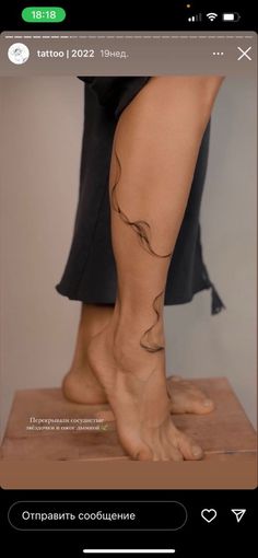 a woman's legs with tattoos on them and the bottom part of her leg