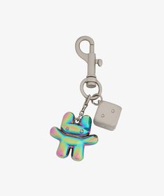 a keychain with an image of a small toy on it's side