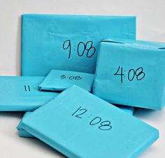 four blue blocks with numbers written on them