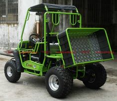 a green utility vehicle parked in front of a building