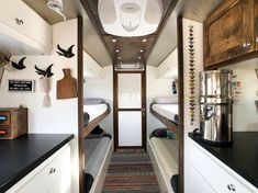 the interior of a camper with bunk beds