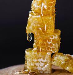 a piece of honey sitting on top of a wooden table