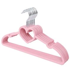 a pink plastic hanger with heart shaped clips