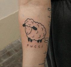 a person with a tattoo on their arm has a sheep drawn on the side of his arm