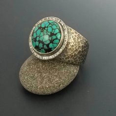 Sterling silver turquoise ring for men, handmade with care by me in my home studio. This bohemian style ring has a beautiful 16mm round Hubei Turquoise bezel set with an antiqued hammered finish on the silver. Made heavy and durable with men in mind. This is a great statement ring and is very comfortable to wear. Perfect unique jewelry gift for men. Shipping: This is ring finished and ready to ship in 1-2 business days All jewelry is packed in a gift box. Gift wrapping is available upon request. Mens Turquoise Rings, Box Gift Wrapping, Bohemian Style Rings, Silver Ring Men, Birthday Gift For Husband, Hubei Turquoise, Mens Wedding Bands Unique, Wanderlust Jewelry, Silver Turquoise Ring