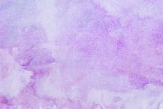 an abstract purple and white background with watercolor stains