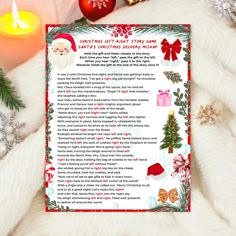 a christmas letter to santa claus on a white blanket with candles and ornaments around it