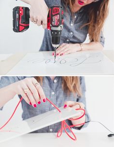 a woman is working with some wires and tools on the table, while another woman holds a drill in her hand