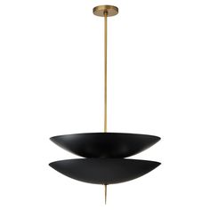 two black and gold pendant lights hanging from the ceiling