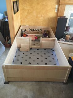 a dog bed made out of cardboard with puppies written on the top and bottom