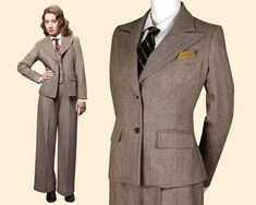 "Your search for the perfect vintage ladies suit has finally come to an end. Wide peaked lapels and slightly emphasized shoulders provide for sharp masculine accents that complete excellently the womanly curves of this jacket. It is masterfully fitted with superbly placed darts and hugs your female curves like a dream! Delicate details like the two welt pockets with pocket flaps and a chest pocket provide room for a pocket square to refine the look even further. Paired with the matching high-wai Women Vintage Suits, 1920s Business Woman, 1920s Office Fashion, 1920s Womens Suit, Dark Academia 30s, Women In Suits Vintage, Vintage Winter Suits For Office, Vintage Winter Office Suits, Vintage Brown Tweed Jacket With Suit Collar