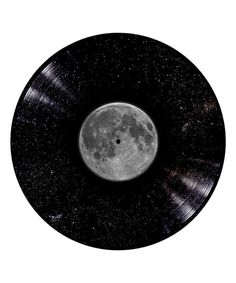 an old record with the moon in the middle and stars on it's side