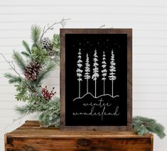 a black and white poster with pine trees in the background that says winter wonderland on it