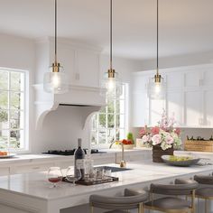 a kitchen with white counter tops and stools next to a wine bottle on the island