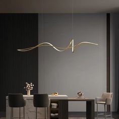 an elegant dining room with modern lighting fixtures