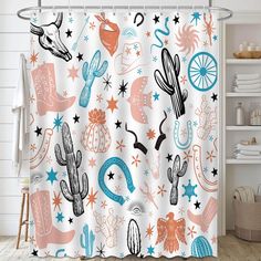 a shower curtain with cactus and stars on it