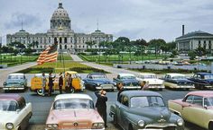 old cars parked in front of the capitol building