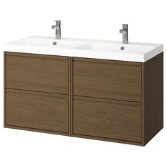 two white sinks sitting on top of a wooden cabinet