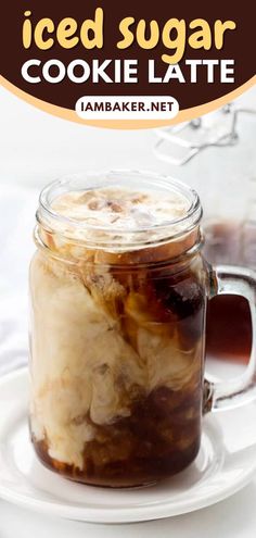 iced sugar cookie latte in a glass jar on a white plate with text overlay