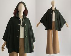 rare 1960s Loden Plankl cape with hood and arm slits; shepherd check in earthy green; traditional Tracht cape overcoat for women; contrast check lined; in very good condition; the front buttons I purchased separately, so they are different from the buttons on the arm slits and the hood, I will attach them as a gift to the cape; not marked a size, will best fit small to large; please refer to measurements (we measured flat): length 29" waist free  as a result of previous use, things may have minor defects. as proponents of worn clothing, we hope you will see the character and value of this piece. any significant faults will attempt to be recorded and goods are pre-handwashed, de-piled, and repaired as necessary since we give measures, we won't accept any returns for sizing difficulties. be Capelet Outfit, Nature Hats, Cape Overcoat, Hoodie Cloak, Hood Cloak, Cloak Outfit, Cape With Hood, Cloak Coat, Cape Designs