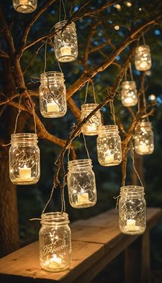 mason jar lights hanging from a tree branch