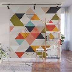 an abstract geometric wall mural in a living room